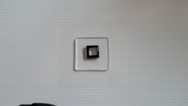 ②フィルムを接着して封入物を入れてコーティングする